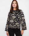 Floral sweater with a crew neckline, featuring intricate patterns for an elegant look. Designed by Charlie B.
