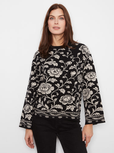 Floral sweater with a crew neckline, featuring intricate patterns for an elegant look. Designed by Charlie B.