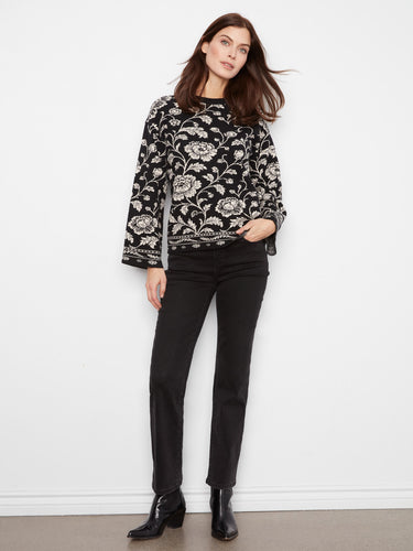 Stylish sweater showcasing drop shoulders, adding a modern touch to its classic design. Crafted by Charlie B.