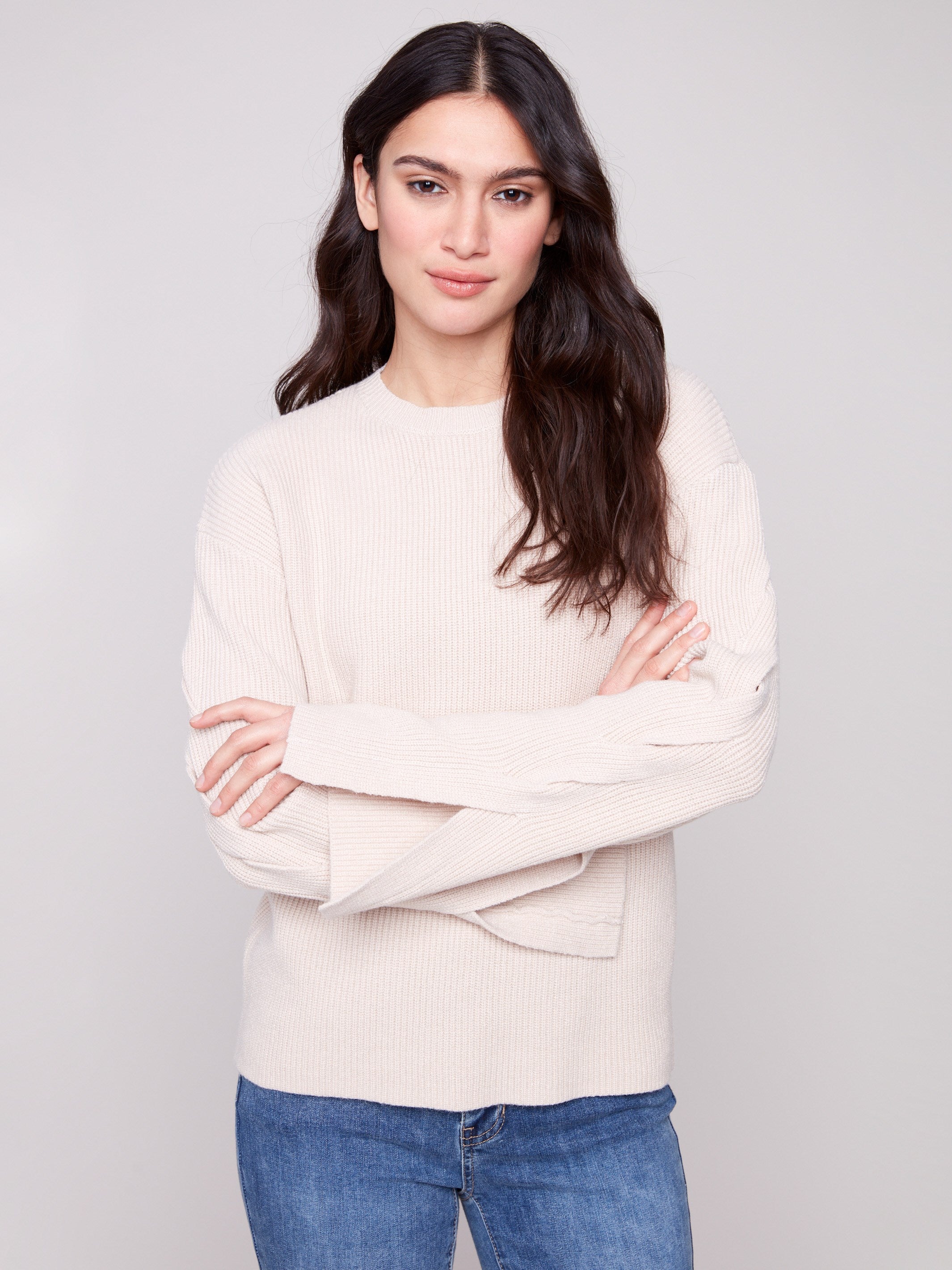 Oat sweater showcasing drop shoulders and elegant design by Charlie B.