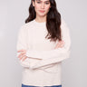 Oat sweater showcasing drop shoulders and elegant design by Charlie B.