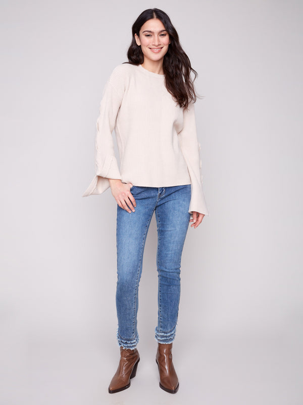Heathered oat sweater with intricate sleeve details for added flair by Charlie B.