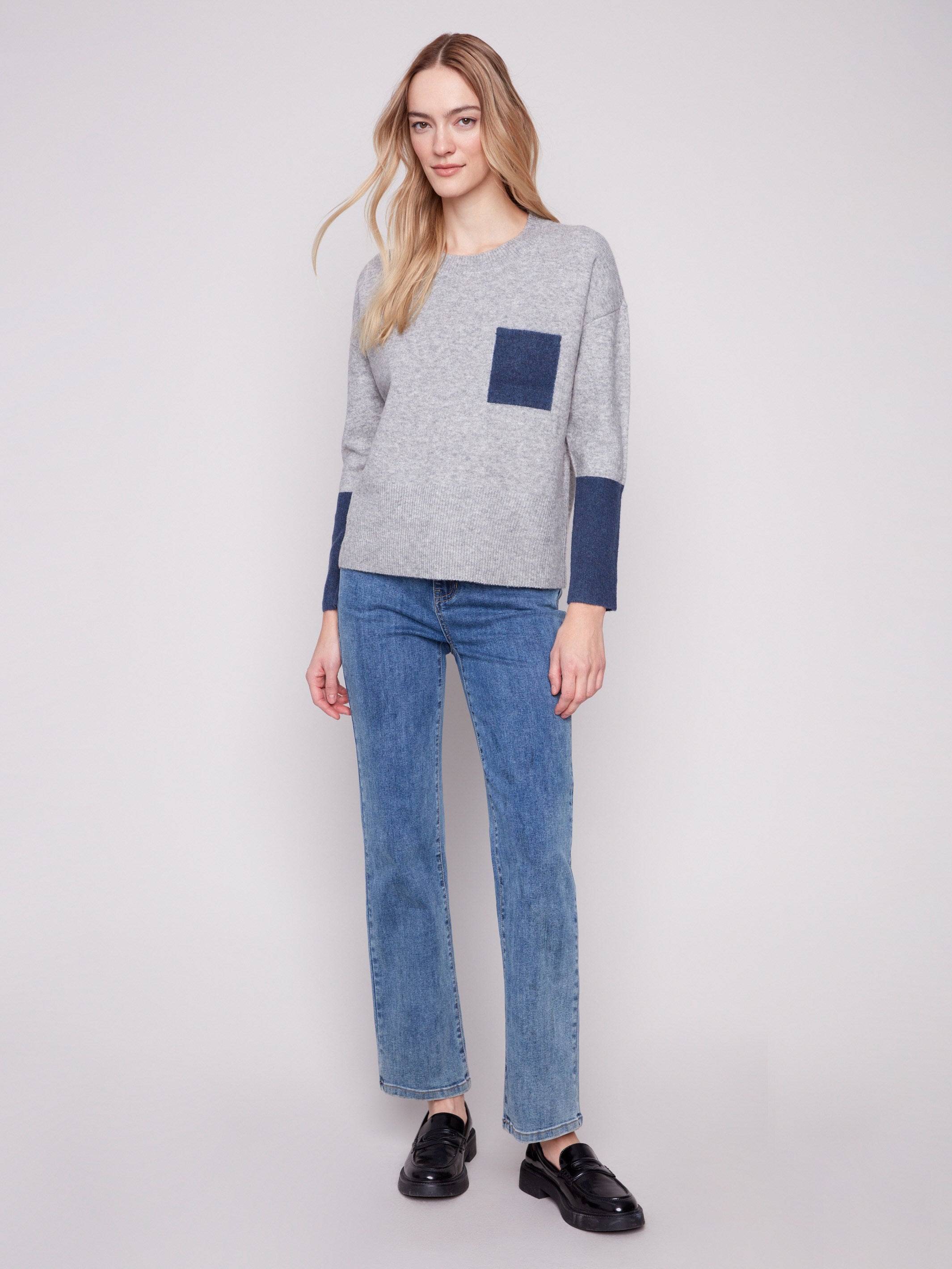 Long sleeves add warmth to this heather grey sweater, enhanced by a striking navy chest pocket by Charlie B.