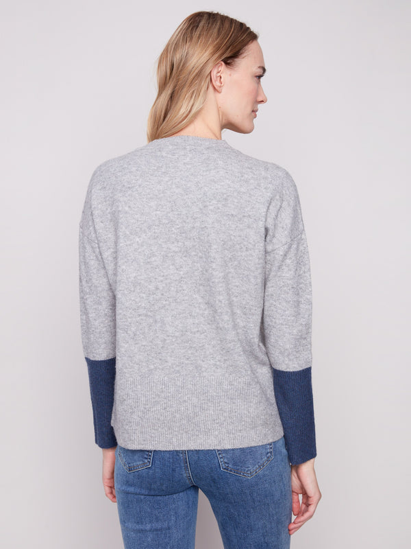 The contrast ribbed sleeve cuffs bring a stylish touch to this heather grey sweater with navy accents by Charlie B.