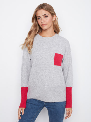 This sweater features a relaxed fit, offering comfort and style with its casual silhouette. By Charlie B.
