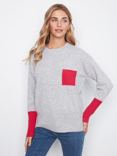 Designed with long sleeves, this sweater ensures warmth and elegance in cooler weather. By Charlie B.