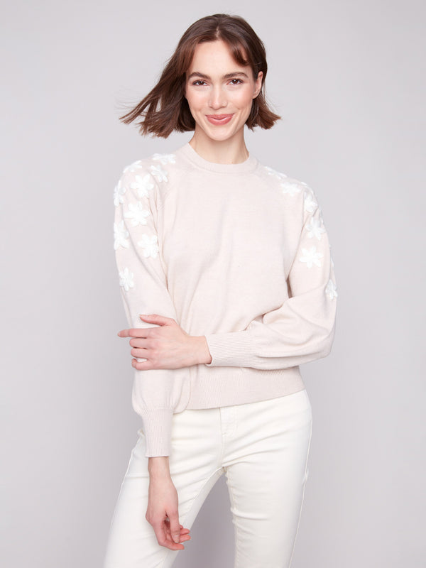 The heather oat sweater features stylish white floral embroidery, perfect for a refined look by Charlie B.