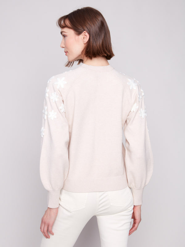 Raglan puff sleeves add a unique touch to this heather oat sweater with delicate floral accents by Charlie B.