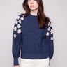 Denim sweater with raglan puff sleeves and floral embroidery, offering a stylish and comfortable fit by Charlie B.