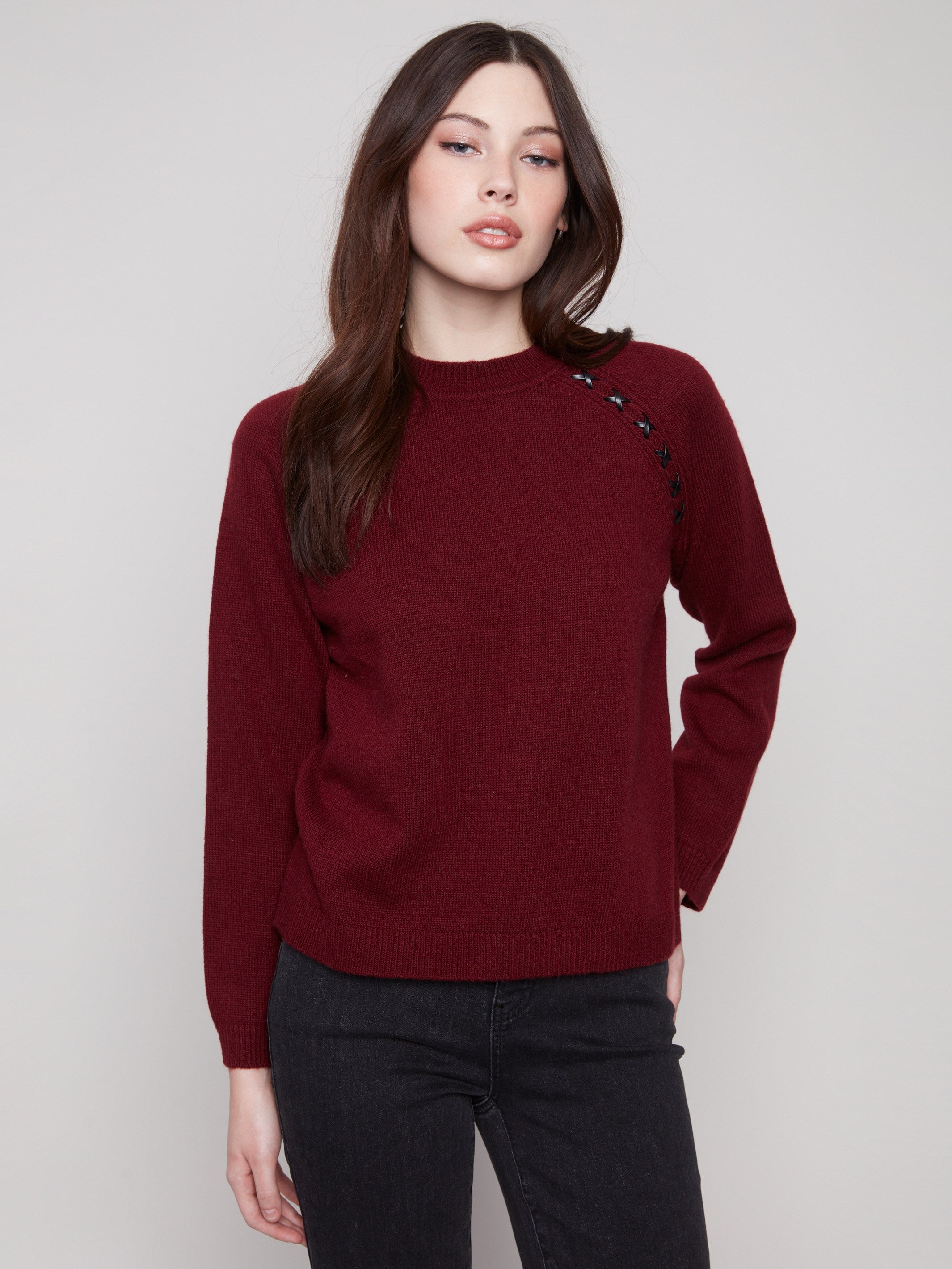 Cabernet sweater featuring a classic crew neck design, paired with stylish knit cuffs for added comfort by Charlie B.