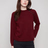Cabernet sweater featuring a classic crew neck design, paired with stylish knit cuffs for added comfort by Charlie B.