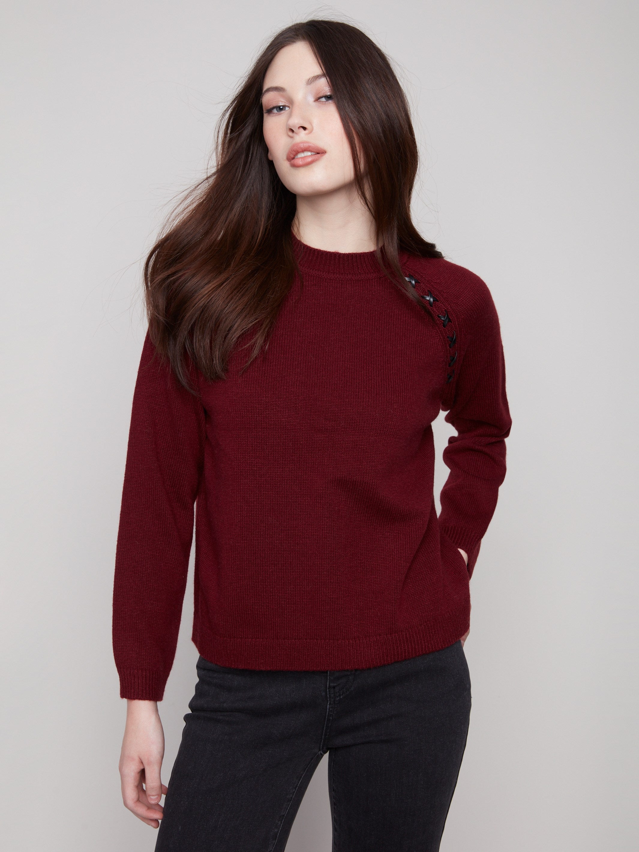 Stylish cabernet crew neck sweater highlighted by its comfortable knit cuffs and sleek design by Charlie B.