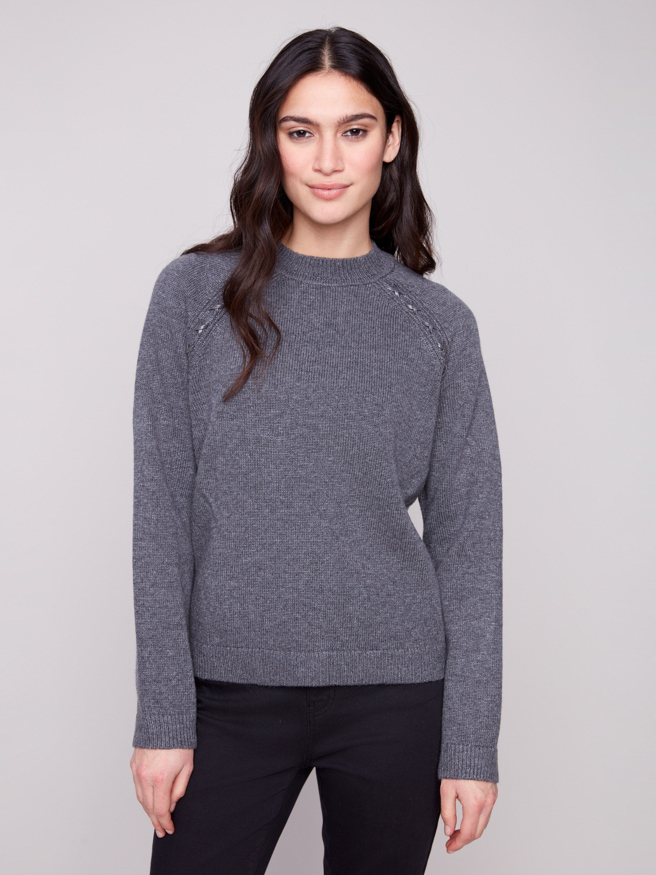 Charcoal sweater featuring a classic crew neck design, perfect for casual elegance. Crafted with attention to detail by Charlie B.