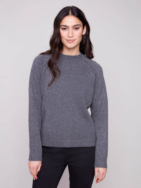 Charcoal sweater featuring a classic crew neck design, perfect for casual elegance. Crafted with attention to detail by Charlie B.