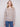 Light brown sweater with long sleeves and charming floral embroidery, perfect for a cozy autumn day by Charlie B.