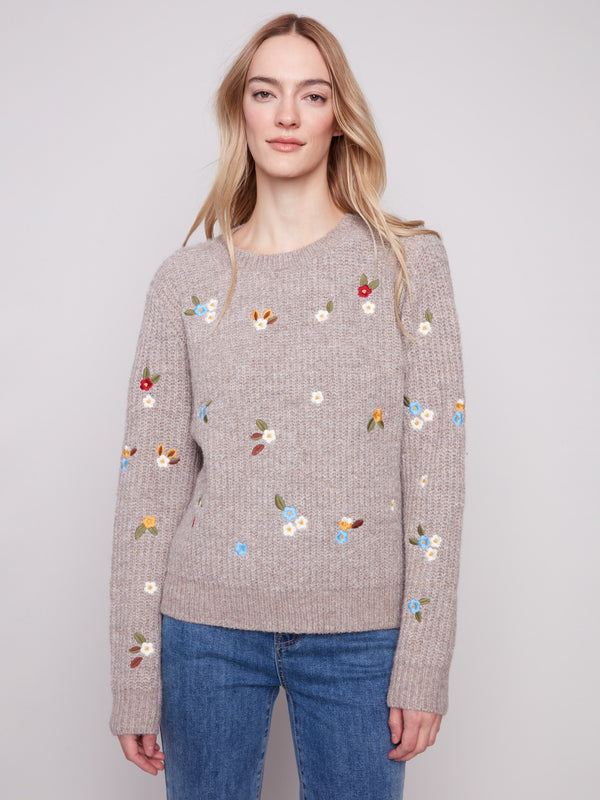 Light brown sweater with long sleeves and charming floral embroidery, perfect for a cozy autumn day by Charlie B.