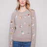 Light brown sweater with long sleeves and charming floral embroidery, perfect for a cozy autumn day by Charlie B.