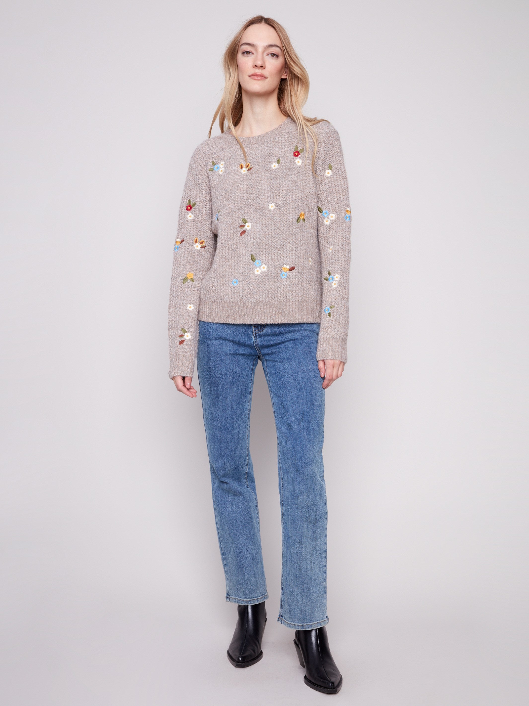 Stylish light brown sweater adorned with intricate floral embroidery and ribbed cuffs, ideal for any casual outing by Charlie B.