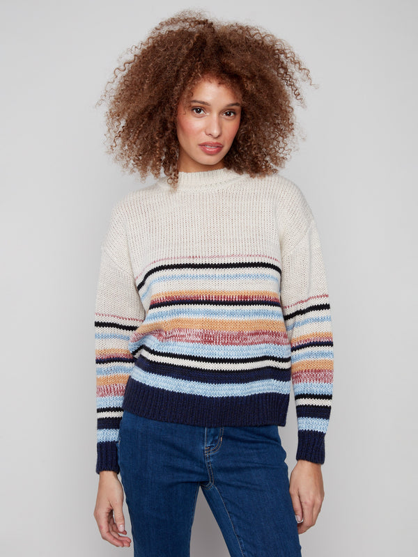 Striped sweater featuring a classic crew neck and vibrant colors, ideal for casual outings by Charlie B.