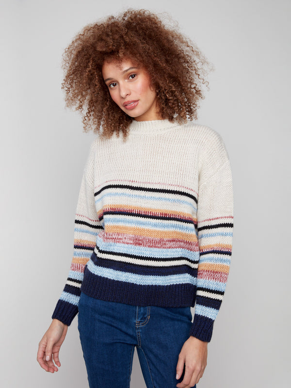 Vibrant multicolor stripes with knit cuffs add a touch of elegance to this cozy sweater by Charlie B.