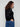 Sophisticated black sweater adorned with shimmering star studs, complemented by raglan sleeve structure by Charlie B.