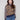 Sweater featuring drop shoulders with a bold leopard print and striped sleeves by Charlie B.
