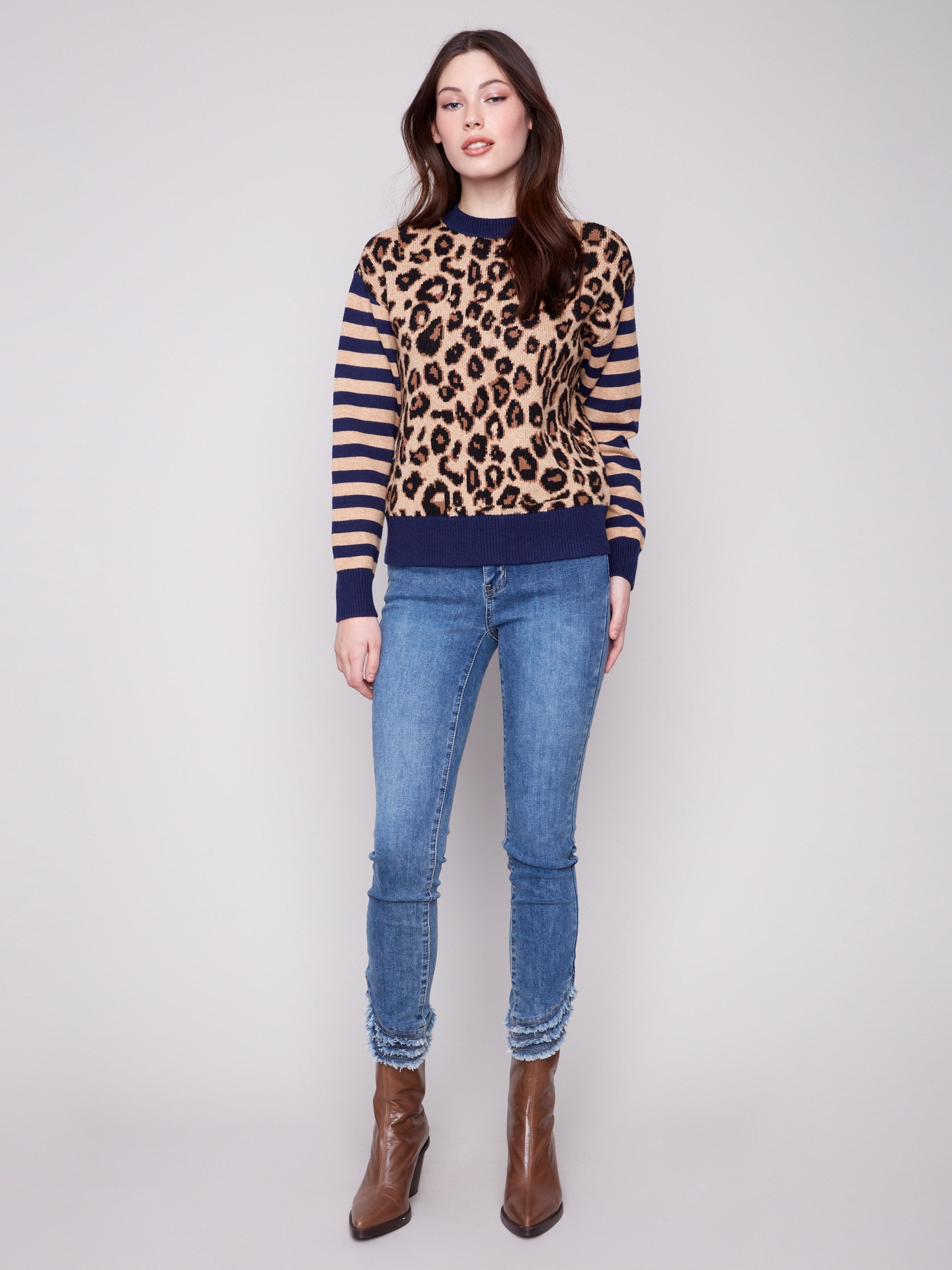 Stylish crew neck sweater with a striking leopard jacquard body and striped details by Charlie B.