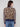 Leopard print sweater showcasing drop shoulders and contrasting striped sleeves by Charlie B.
