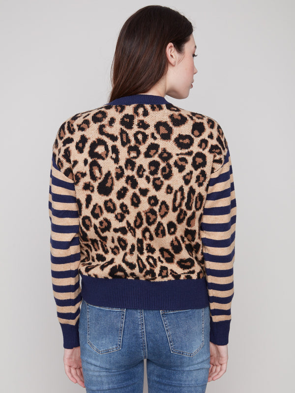 Leopard print sweater showcasing drop shoulders and contrasting striped sleeves by Charlie B.