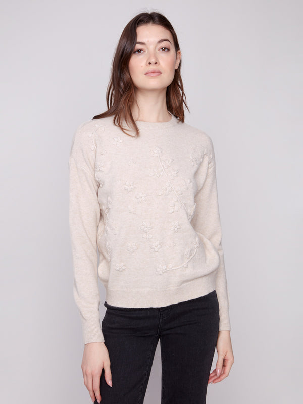 Heather oat sweater with a classic crew neckline and intricate embroidery detailing for an elegant touch by Charlie B.
