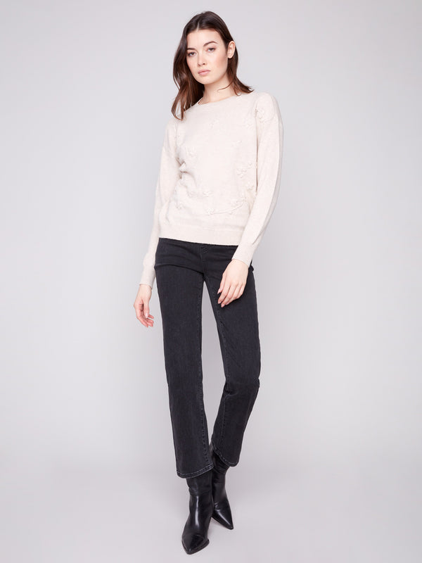 Stylish drop shoulder design on this heather oat sweater, perfect for a relaxed yet chic look by Charlie B.