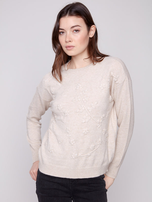 Elegant crew neck and drop shoulders add to the sophisticated charm of this heather oat sweater by Charlie B.