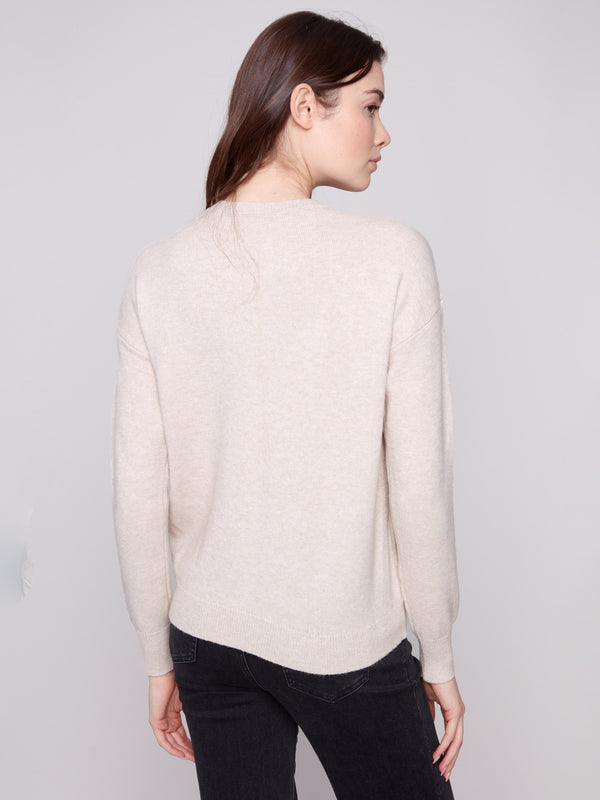 This sweater features tonal embroidery with a refined drop shoulder design, offering both comfort and style by Charlie B.