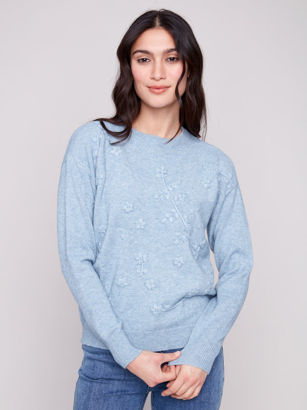 Heather oxford sweater with a classic crew neckline and knit cuffs, showcasing stylish drop shoulders by Charlie B.