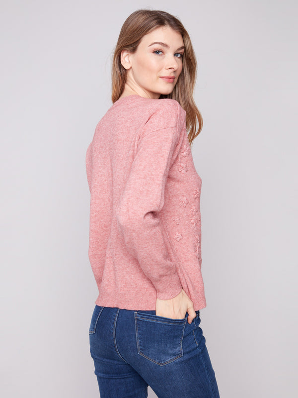 Stylish crew neck sweater accentuated with intricate tonal embroidery, enhancing its elegance by Charlie B.