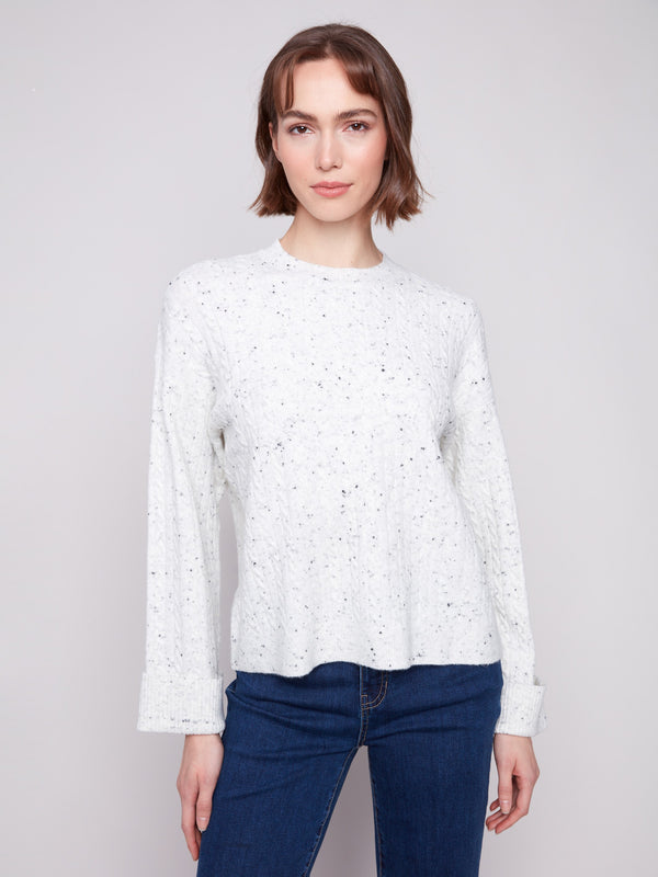 White sweater featuring a drop shoulder design and speckled pattern, ideal for casual wear by Charlie B.