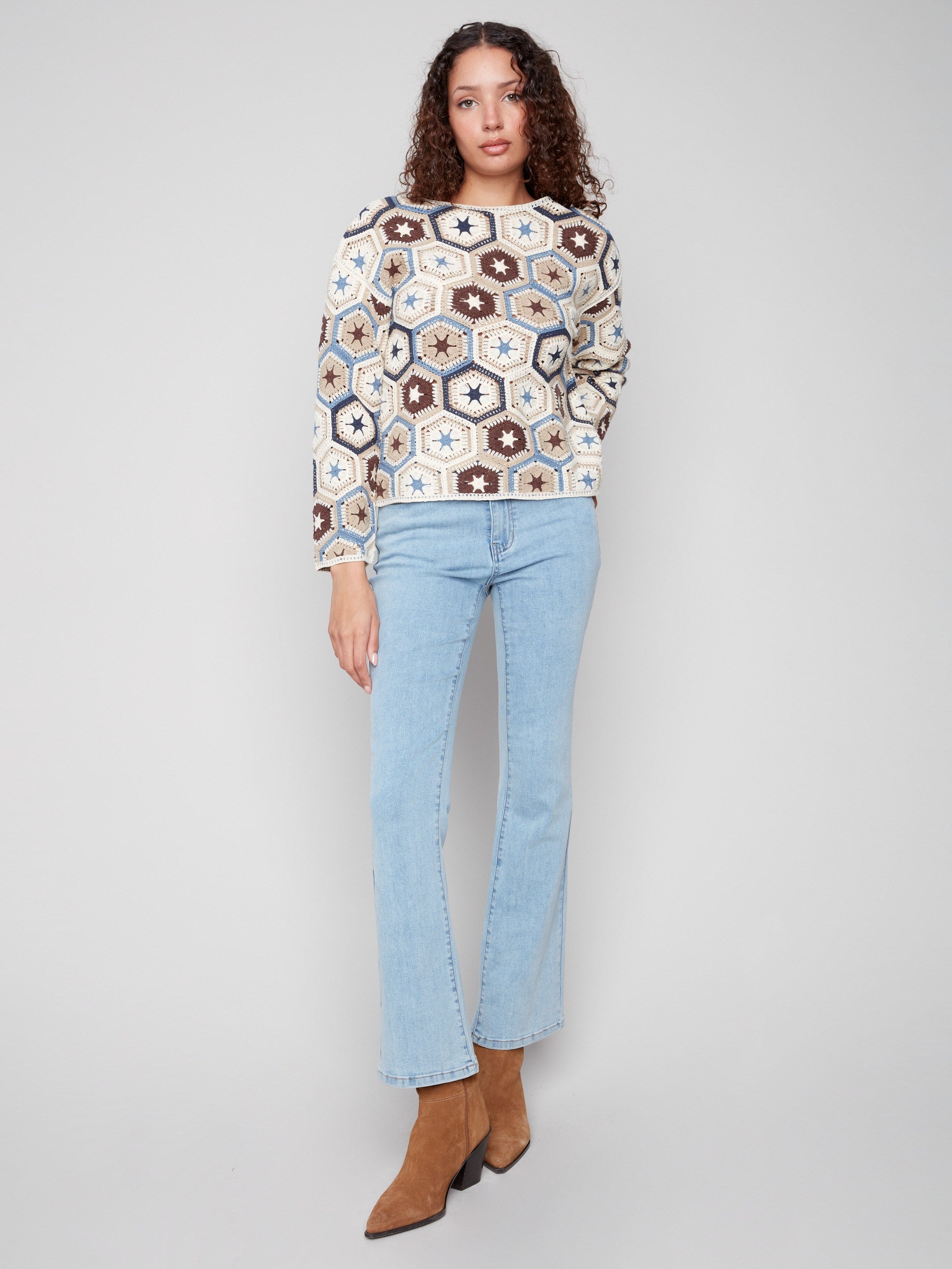 Stylish crochet top featuring long sleeves and a vibrant multicolor design by Charlie B.