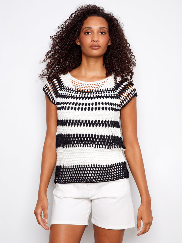 Black and white striped top with a stylish boat neckline, perfect for a casual yet chic look by Charlie B.