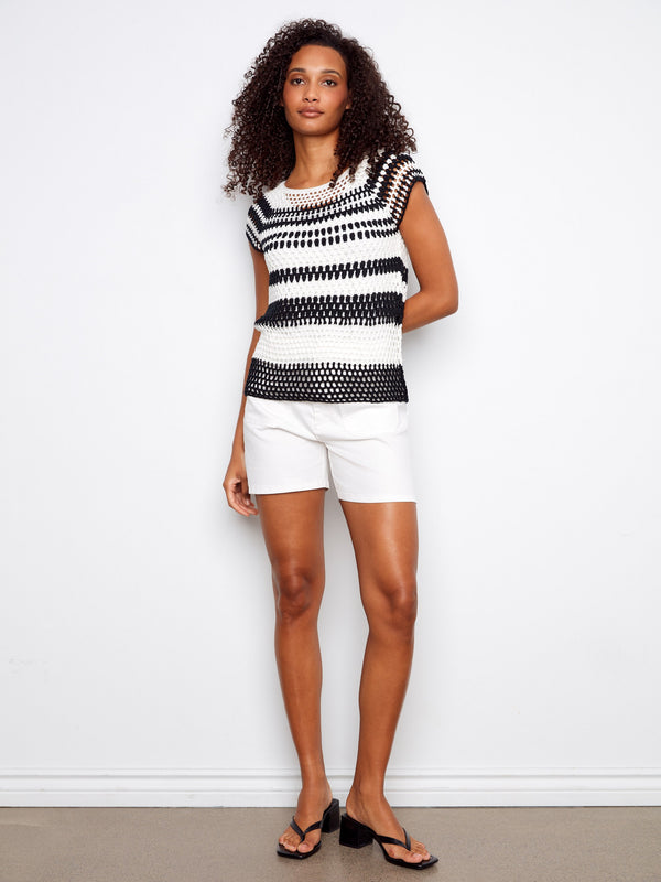 This trendy black and white striped top offers comfort and style, ideal for any casual outing by Charlie B.