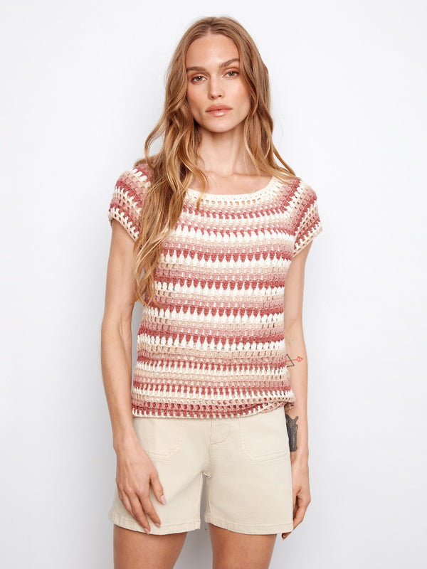 The top features a stylish boat neckline with pink-toned stripes for a chic look by Charlie B.