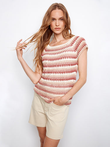 This garment showcases raglan cap sleeves, adding a modern touch to the design by Charlie B.