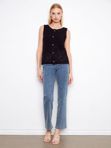 Adorned with a beautiful crochet design, this sleeveless piece is both stylish and breathable. Made by Charlie B.