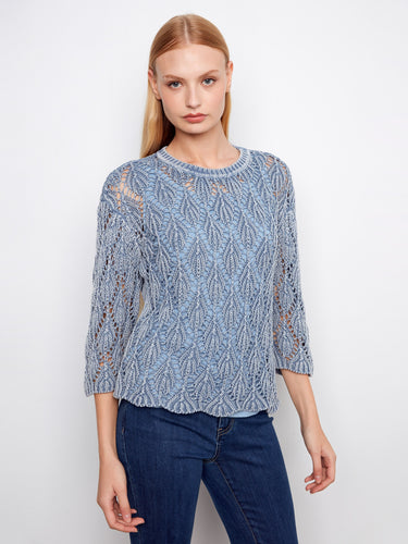 Fashionable blue haze crochet sweater offering a relaxed fit and stylish abstract pattern by Charlie B.
