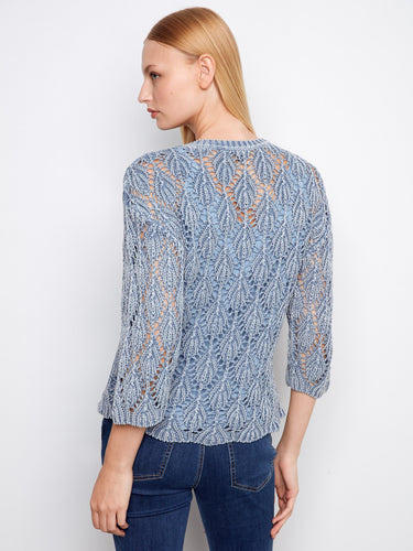 Stylish blue haze crochet sweater with crew neck, showcasing a cold dyed finish for a unique look by Charlie B.