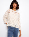 A stylish cotton blend top featuring a crew neck and intricate knit design, perfect for a relaxed fit. By Charlie B.