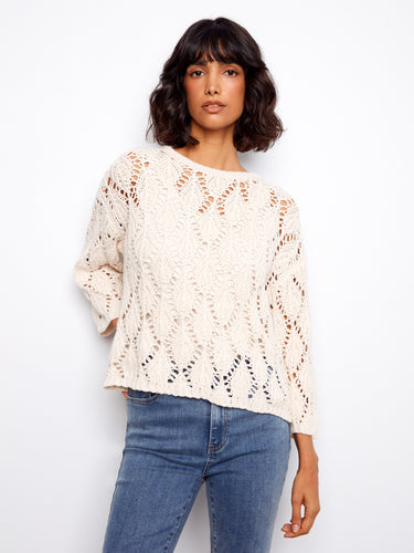 Chic and versatile, this crew neck top with its intricate pattern is made from quality materials. By Charlie B.