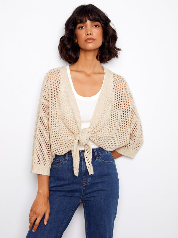 Versatile crochet sweater with adjustable tie-front, combining comfort and style effortlessly by Charlie B.