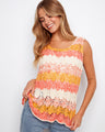Crochet tank top in apricot with a scoop neckline, ideal for sunny days, by Charlie B.
