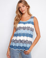 This top features a scoop neckline with intricate patterns in blue and white hues, perfect for casual outings. By Charlie B.