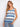This top features a scoop neckline with intricate patterns in blue and white hues, perfect for casual outings. By Charlie B.